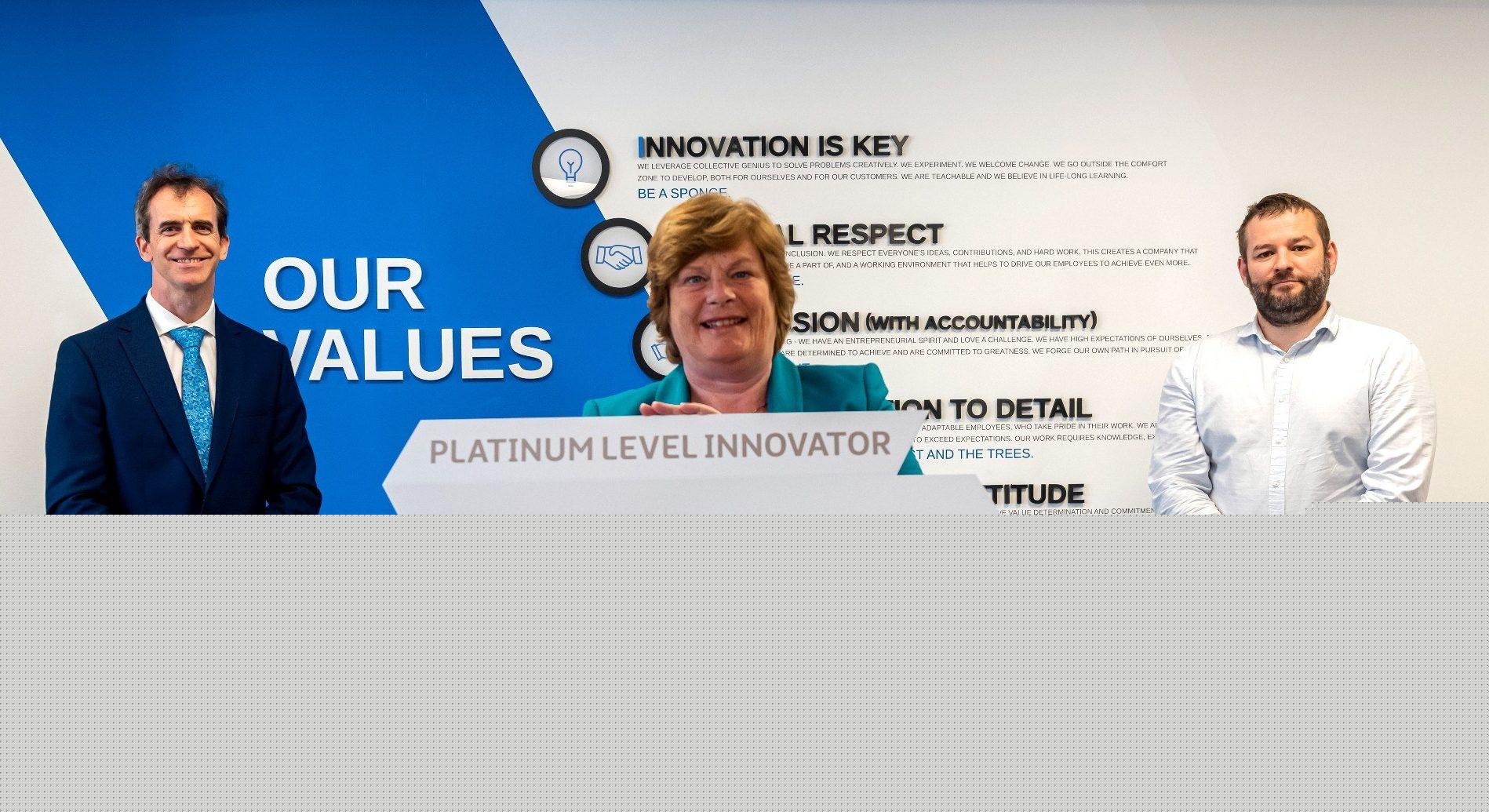PAC Group Engineering Director Elwyn Agnew and Technical Director Gavin Rankin with Dr Vicky Kell Head of Innovation Research Development Invest NI